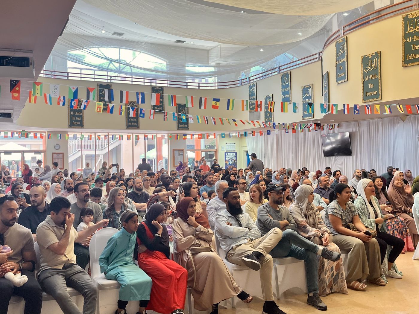 Families seated in the Main Hall for a community event