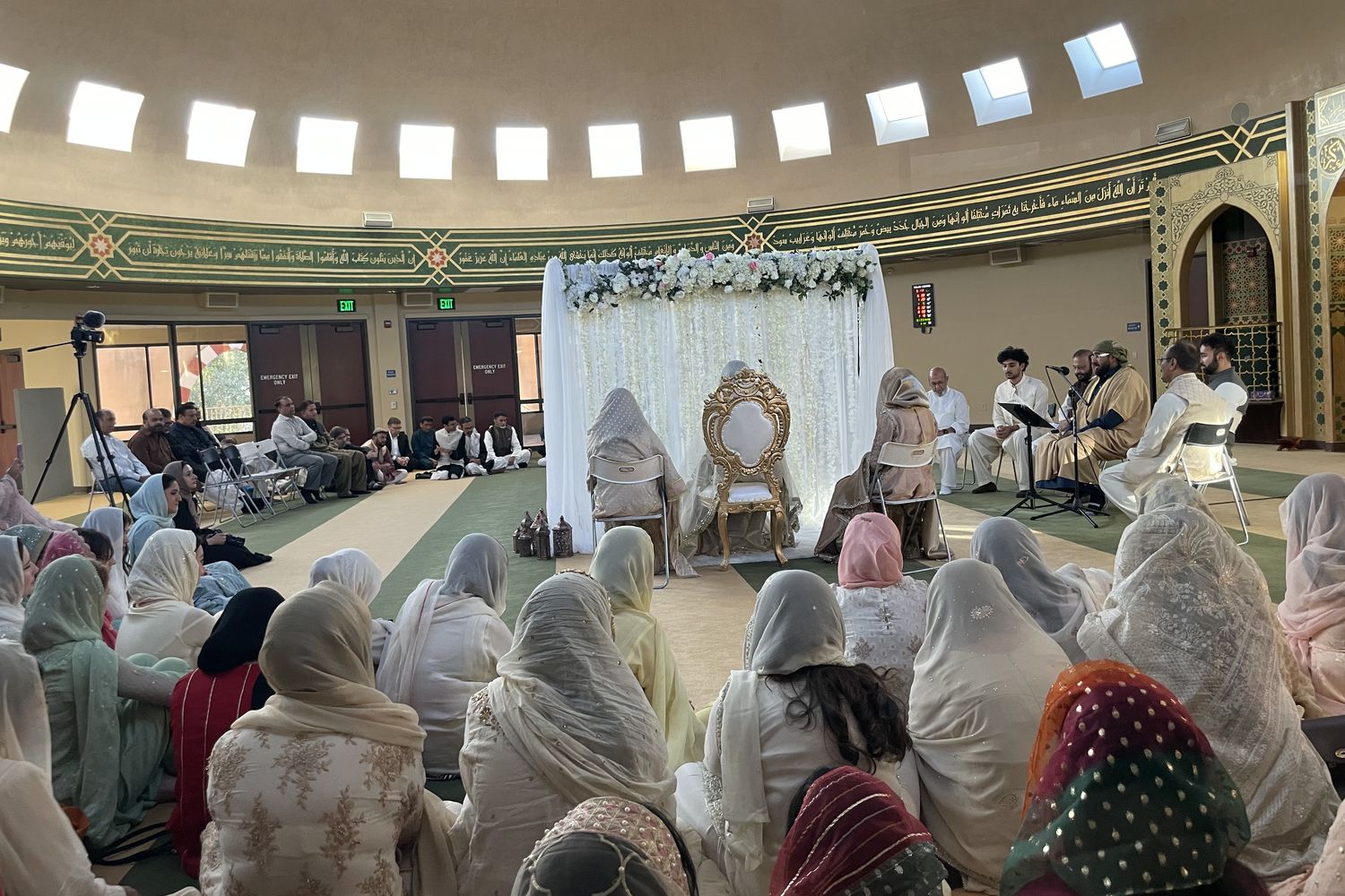 A nikah ceremony in the SALAM masjid, with family seated around the couple